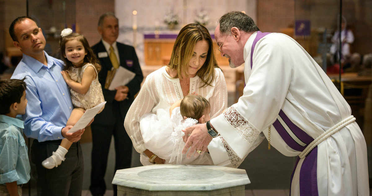 The Rev. Gary Schuschke, associate pastor, baptizes Londynn Levin as her mother Melissa Levin holds her at St. Luke's Lutheran Church on Sunday, March 6, 2016, in Oviedo, Fla. LCMS Communications/Erik M. Lunsford